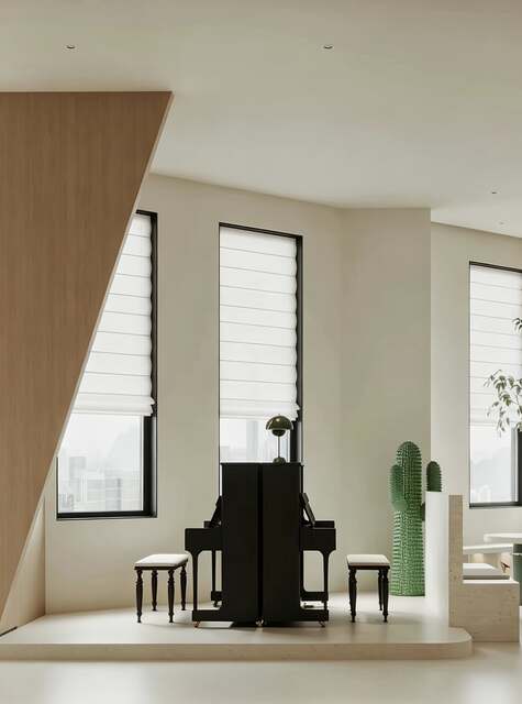 Piano positioned by tall windows in the SingSprout studio